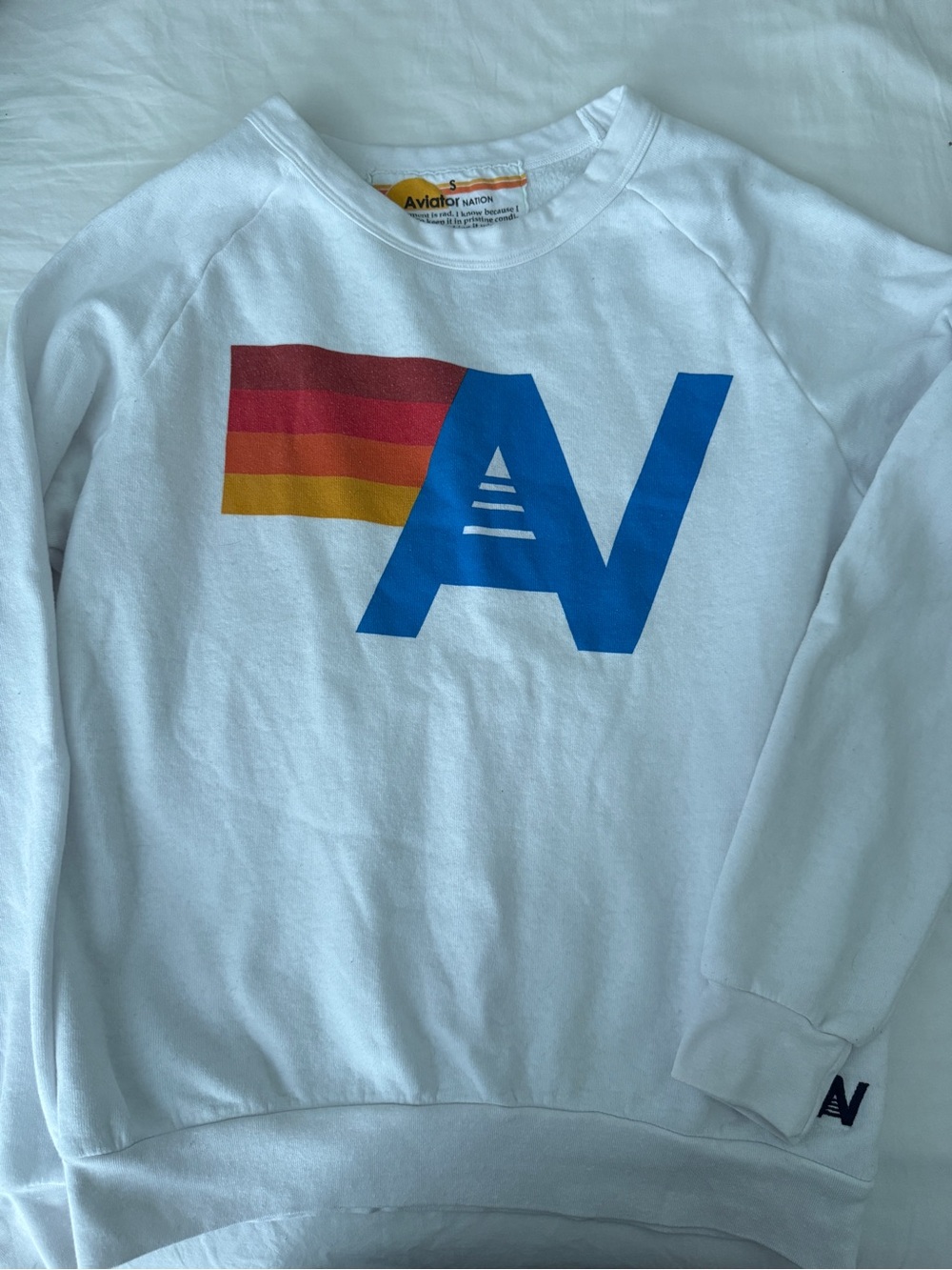 Aviator Nation White Crewneck with Blue 'AV' Logo and Red-Orange-Yellow Stripe